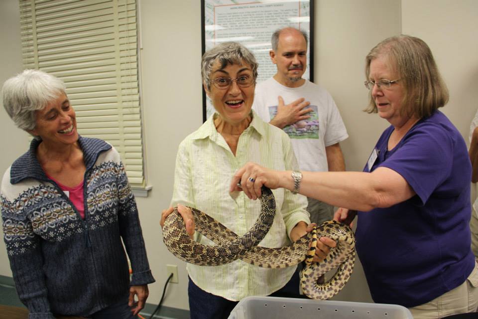 Participant holding snake